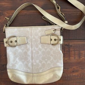 Coach crossbody bag in shades of white canvas with gold leather trim